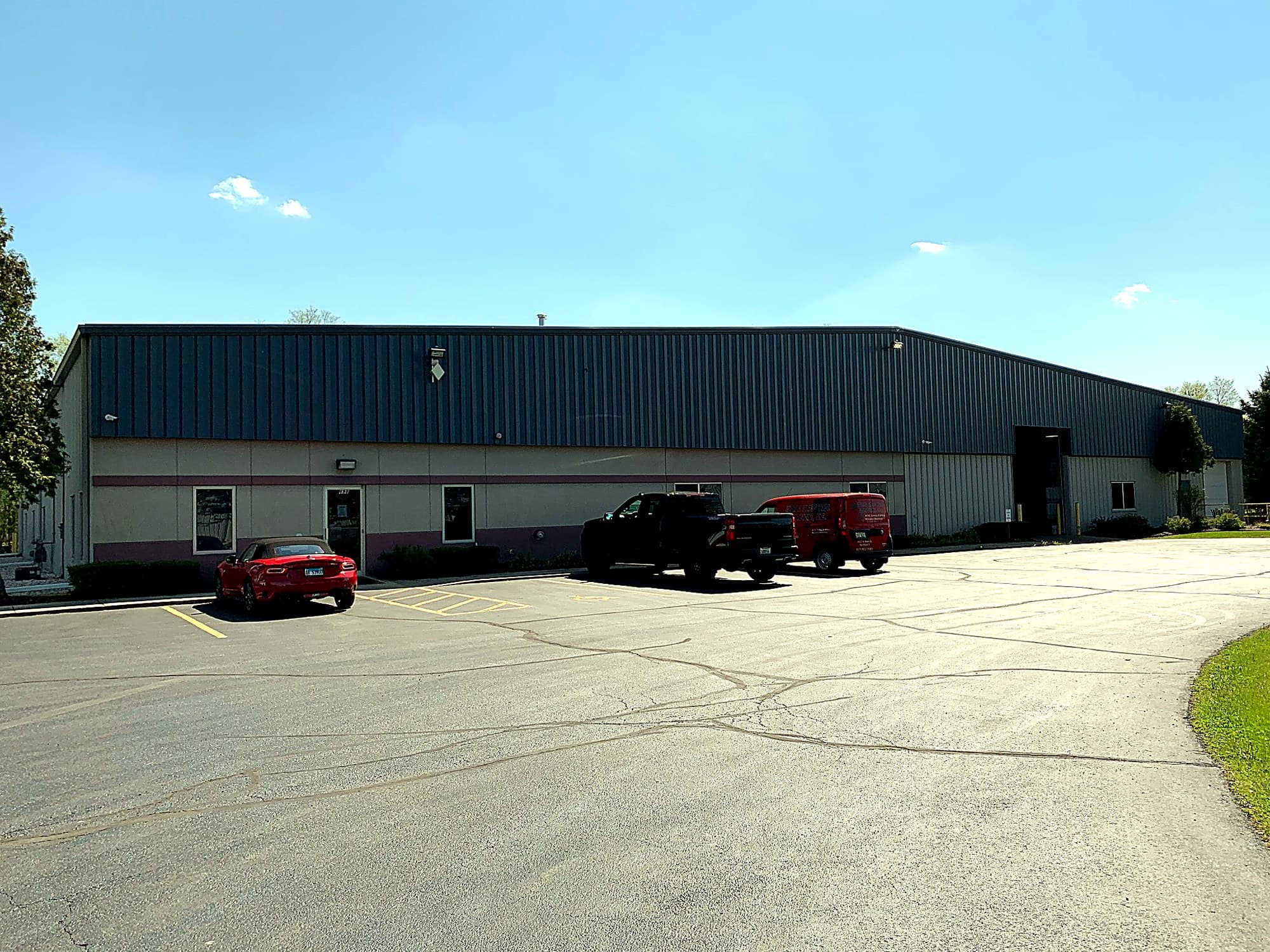 Wide front exterior of the World Class Tool & Machine building.