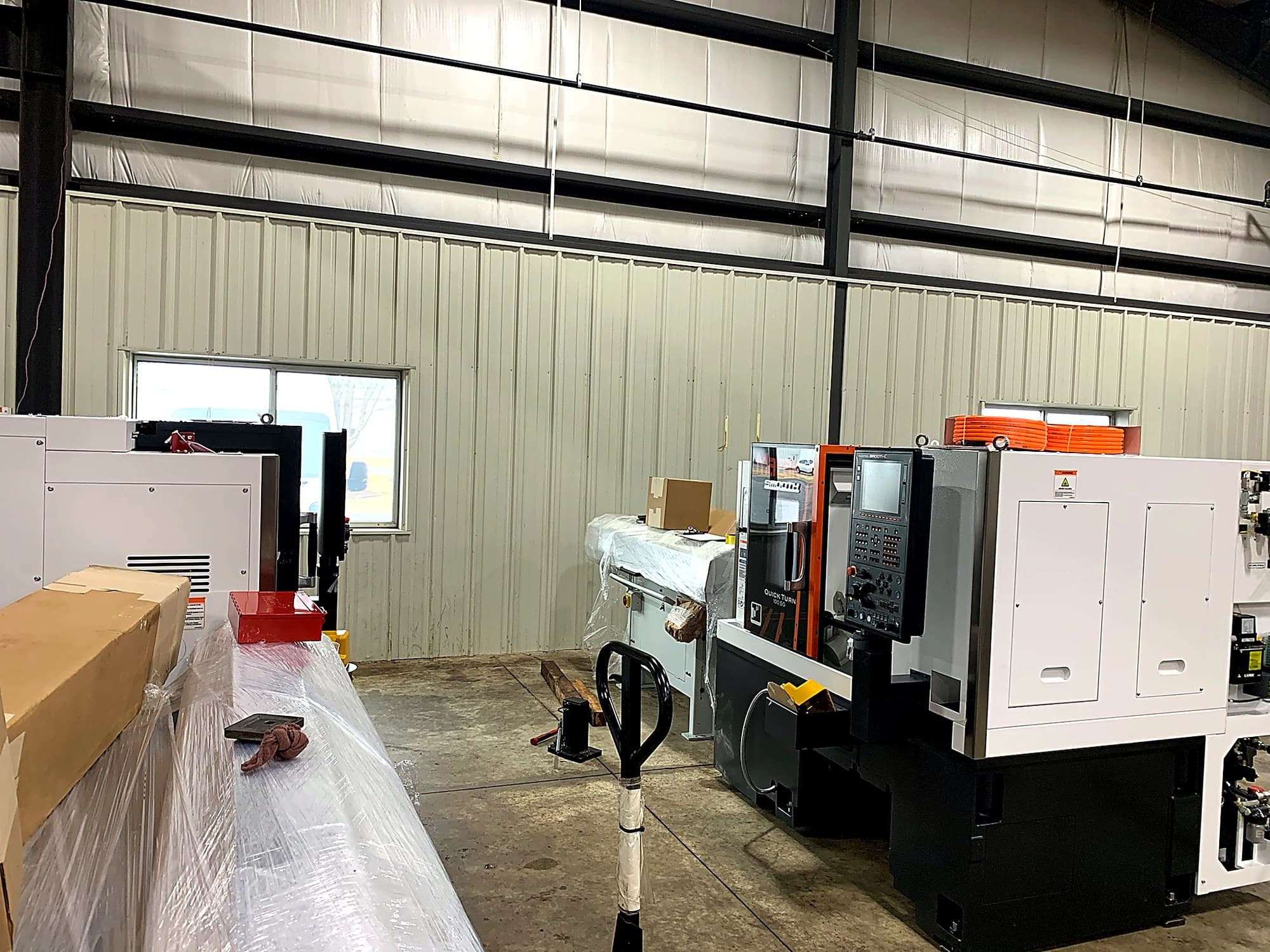 Wide view of newly installed machine in the shop.