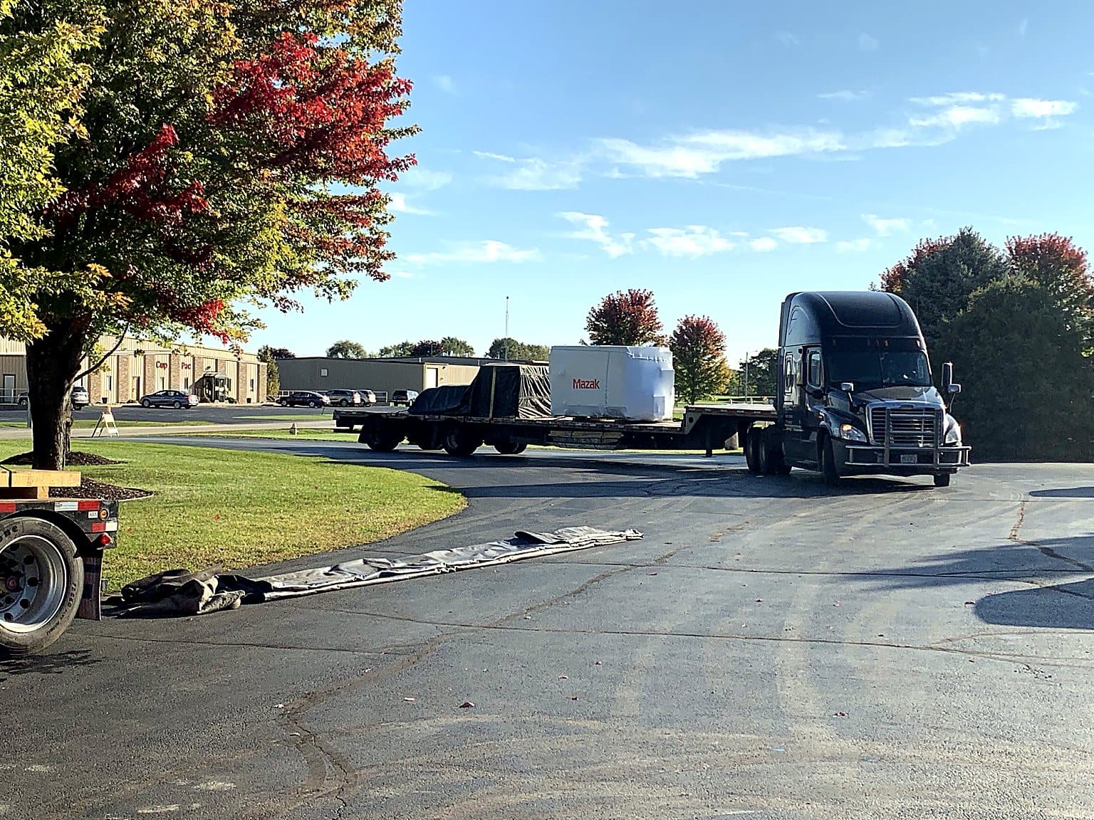 Incoming machine delivery truck arriving at the facility